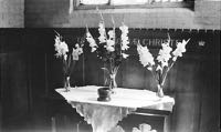 Flowers decorating the altar in the 1950s