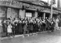 Children queuing outside the Palladium in 1938