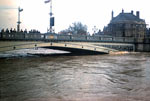 Water rises against the bridge