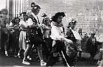 Children parade down Exwick Hill - 1950s