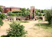 The medieval Exe Bridge is surrounded by traffic