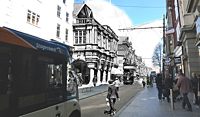 The Guildhall has seen horses, carriages, trams, tanks, bicycles and buses pass its columns