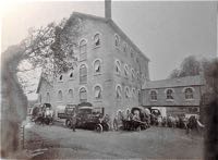 Carts and a steam lorry with workers