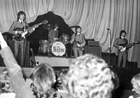 The Beatles on stage.