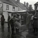 Soldier carries woman to shore