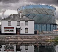 Since removed, the gasholder looms over the inn