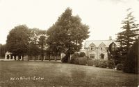 The school, hidden behind the trees