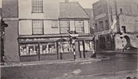 The photo was taken after the war and shows the bombed corner of Palace Gate