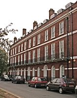 Three original house, and the reconstructed house on the end.