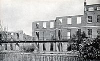 The YWCA and first three burnt out houses of the northern terrace.