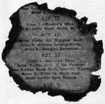 A burnt scrap of play-bill.