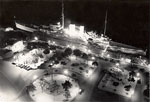 HMS Exeter docked at night